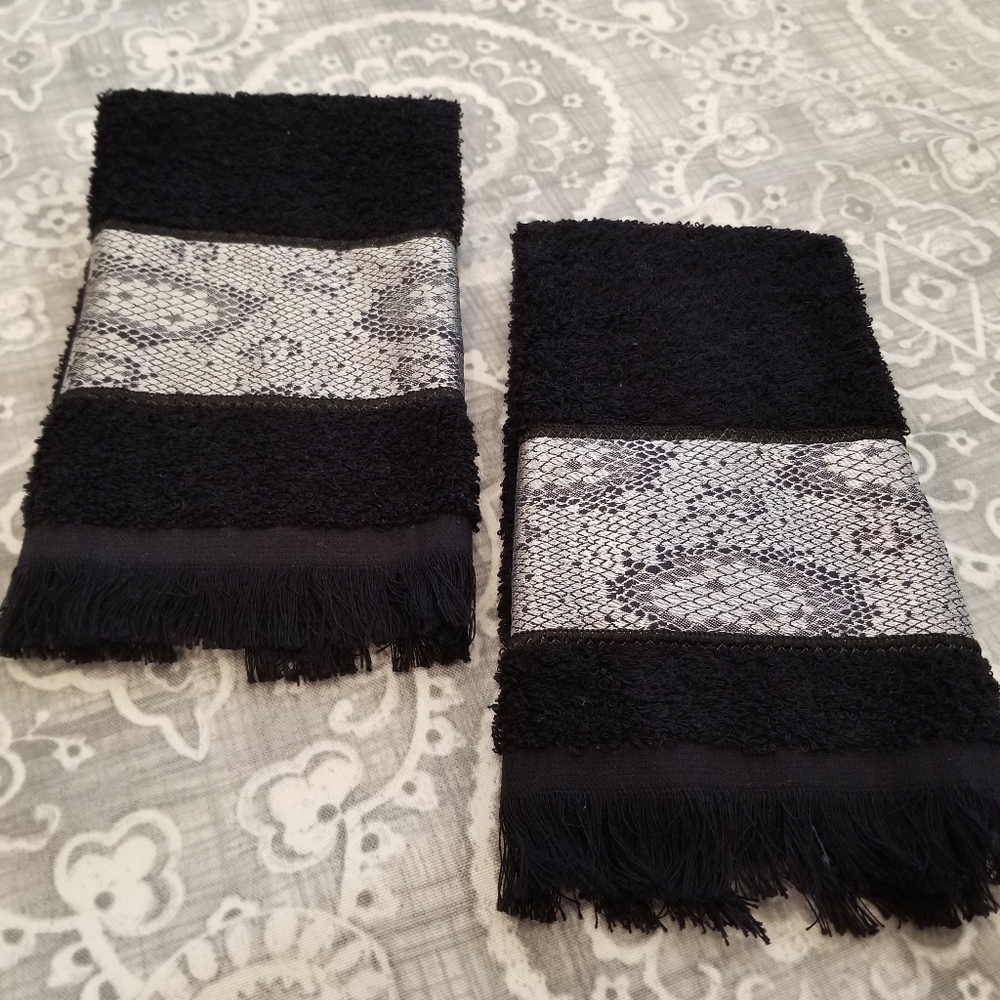 Two Black and Silver hand towels.